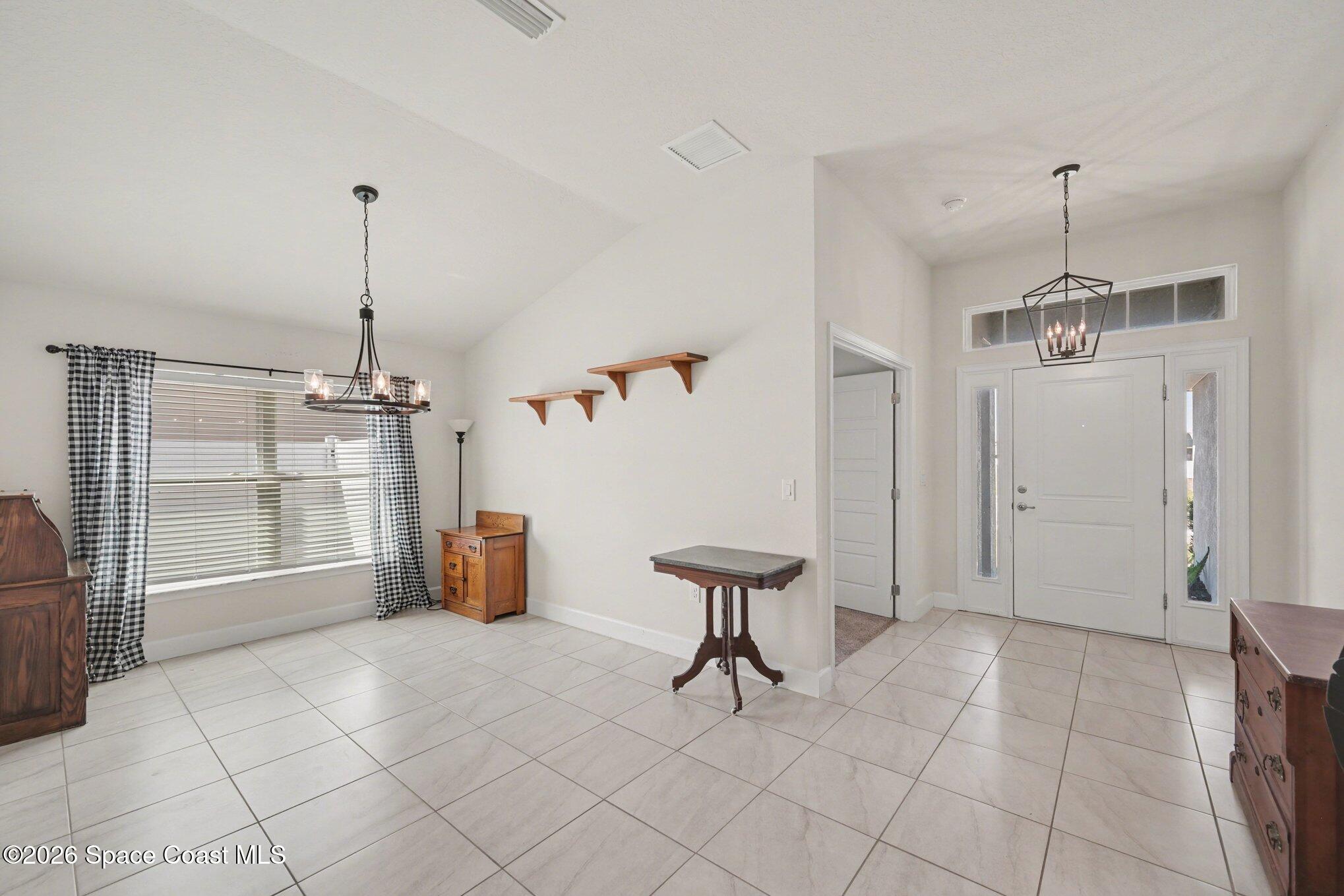 831 Tupelo Circle Cocoa, FL 32926 - Photo 2 of 23 a view of an empty room with a window
