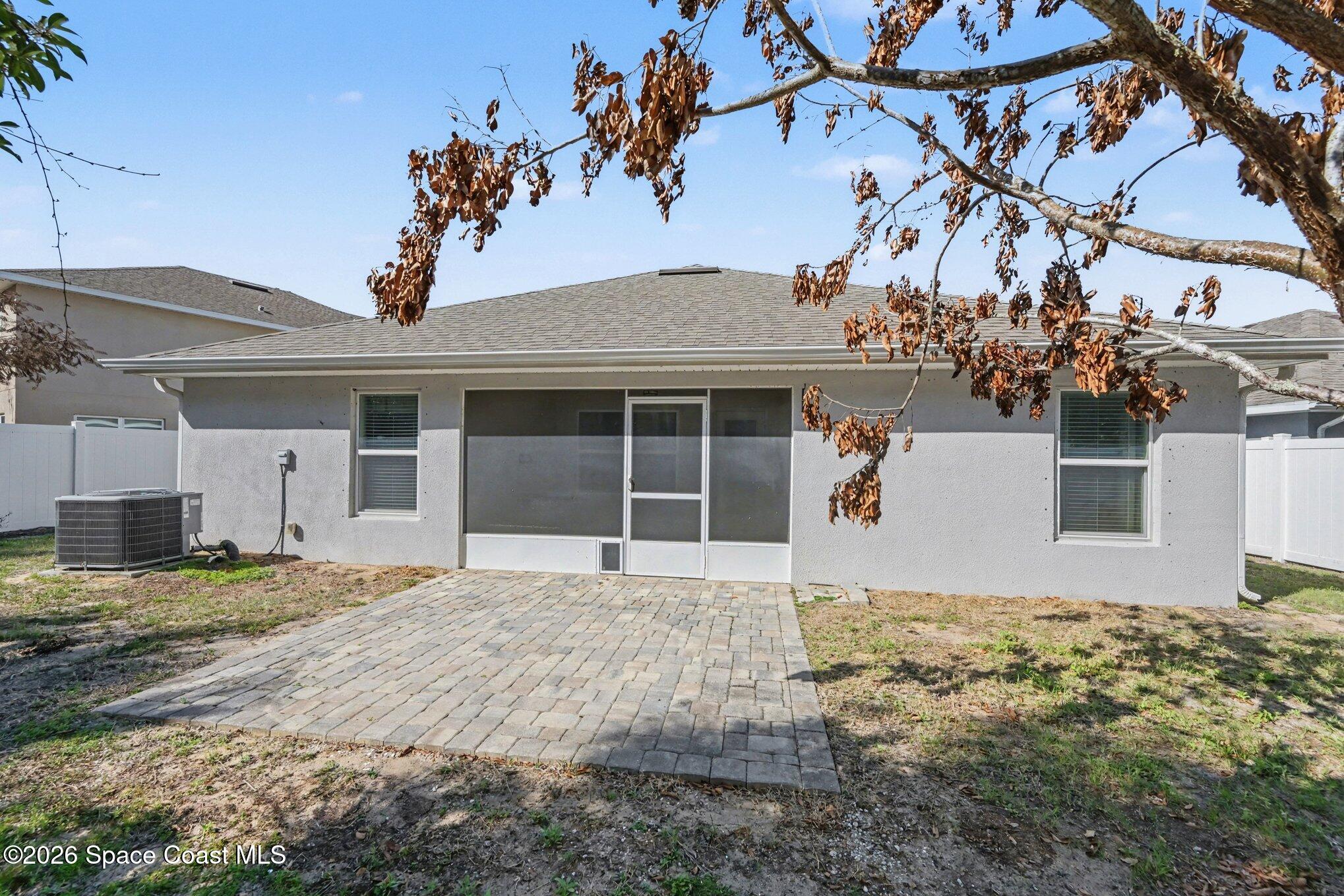 831 Tupelo Circle Cocoa, FL 32926 - Photo 22 of 23 a front view of a house with a yard