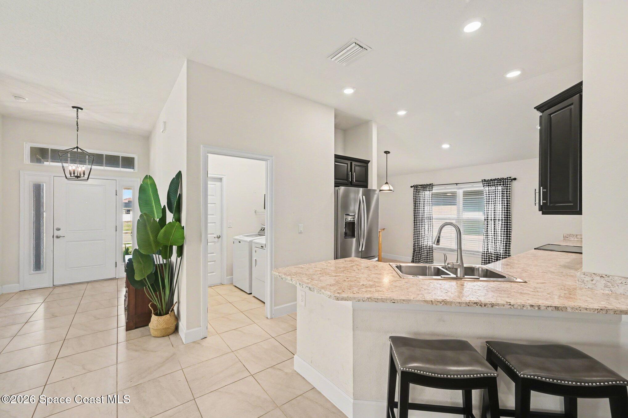 831 Tupelo Circle Cocoa, FL 32926 - Photo 3 of 23 a kitchen with a table and chairs