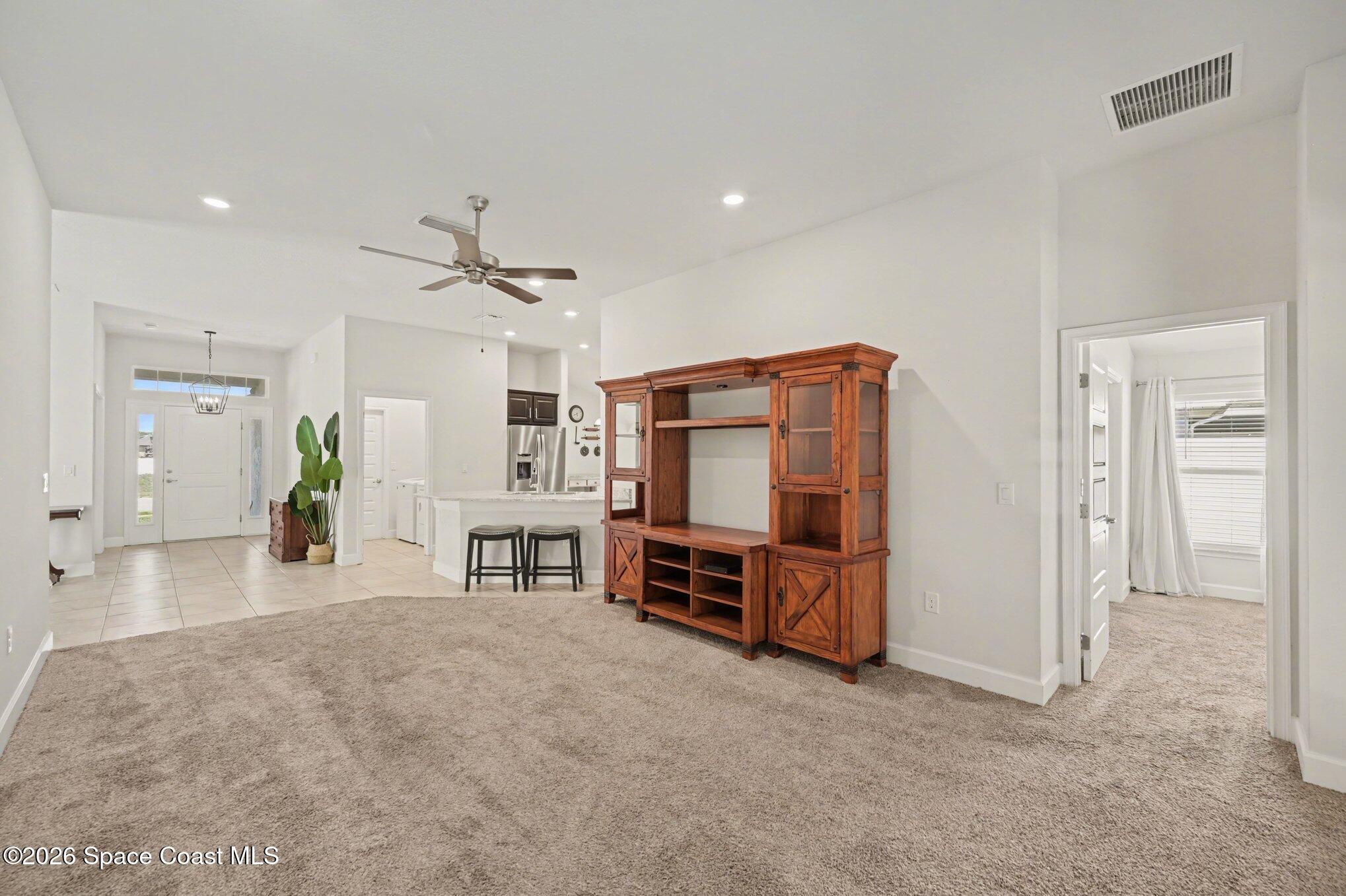 831 Tupelo Circle Cocoa, FL 32926 - Photo 9 of 23 a view of a livingroom with furniture and a flat screen tv