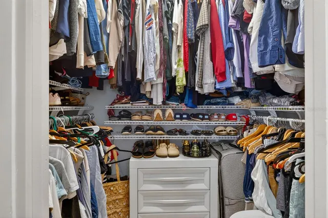 a view of a closet with storage