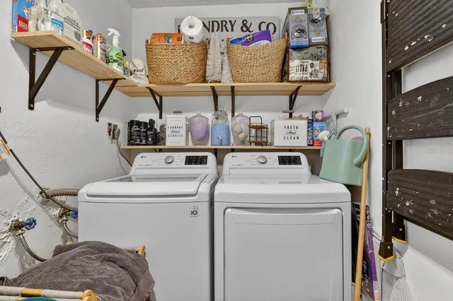 a view of a room with furniture and wooden floor