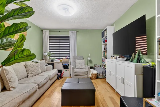 a view of a tables and chairs under an umbrella