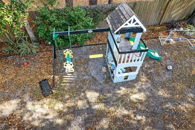a view of a backyard with sitting area