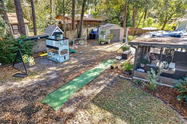 a house view with a sitting space and garden