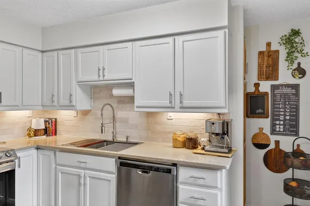 a kitchen with cabinets and appliances
