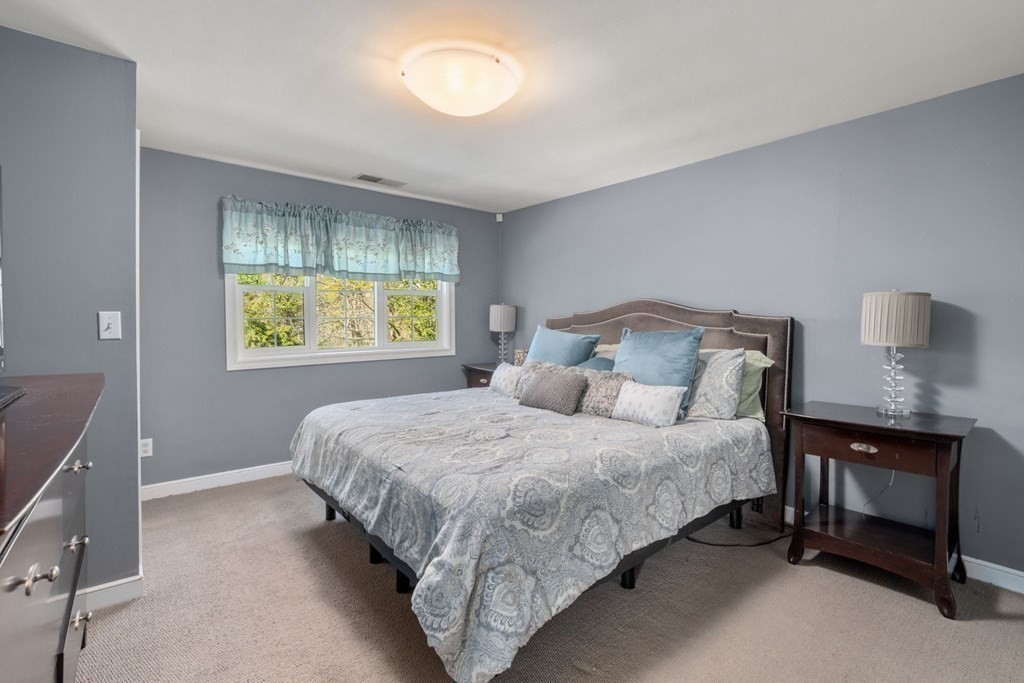 55 Glover Road Needham, MA 02494 - Photo 13 of 22 a bedroom with a bed and window