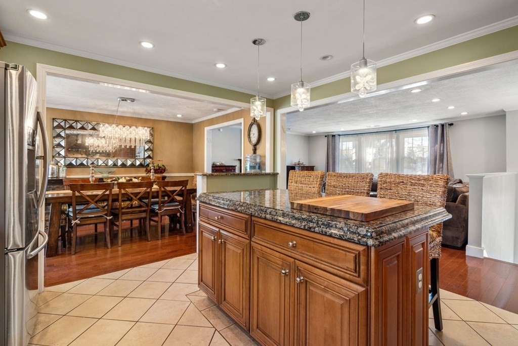 55 Glover Road Needham, MA 02494 - Photo 4 of 22 a kitchen with lots of counter top space and furniture