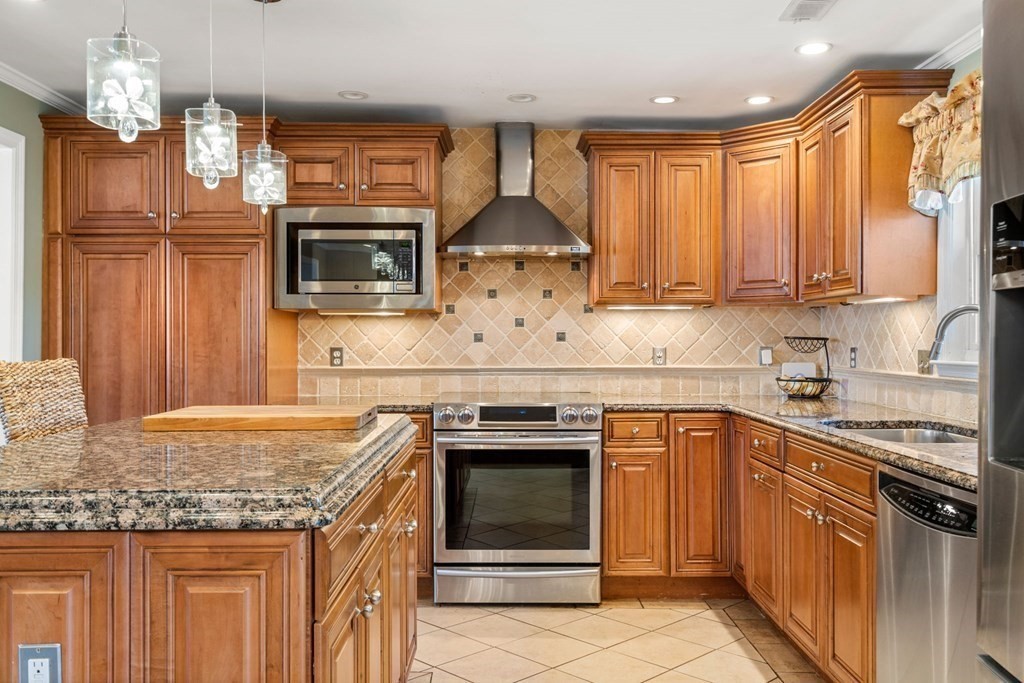 55 Glover Road Needham, MA 02494 - Photo 5 of 22 a kitchen with a stove sink and microwave