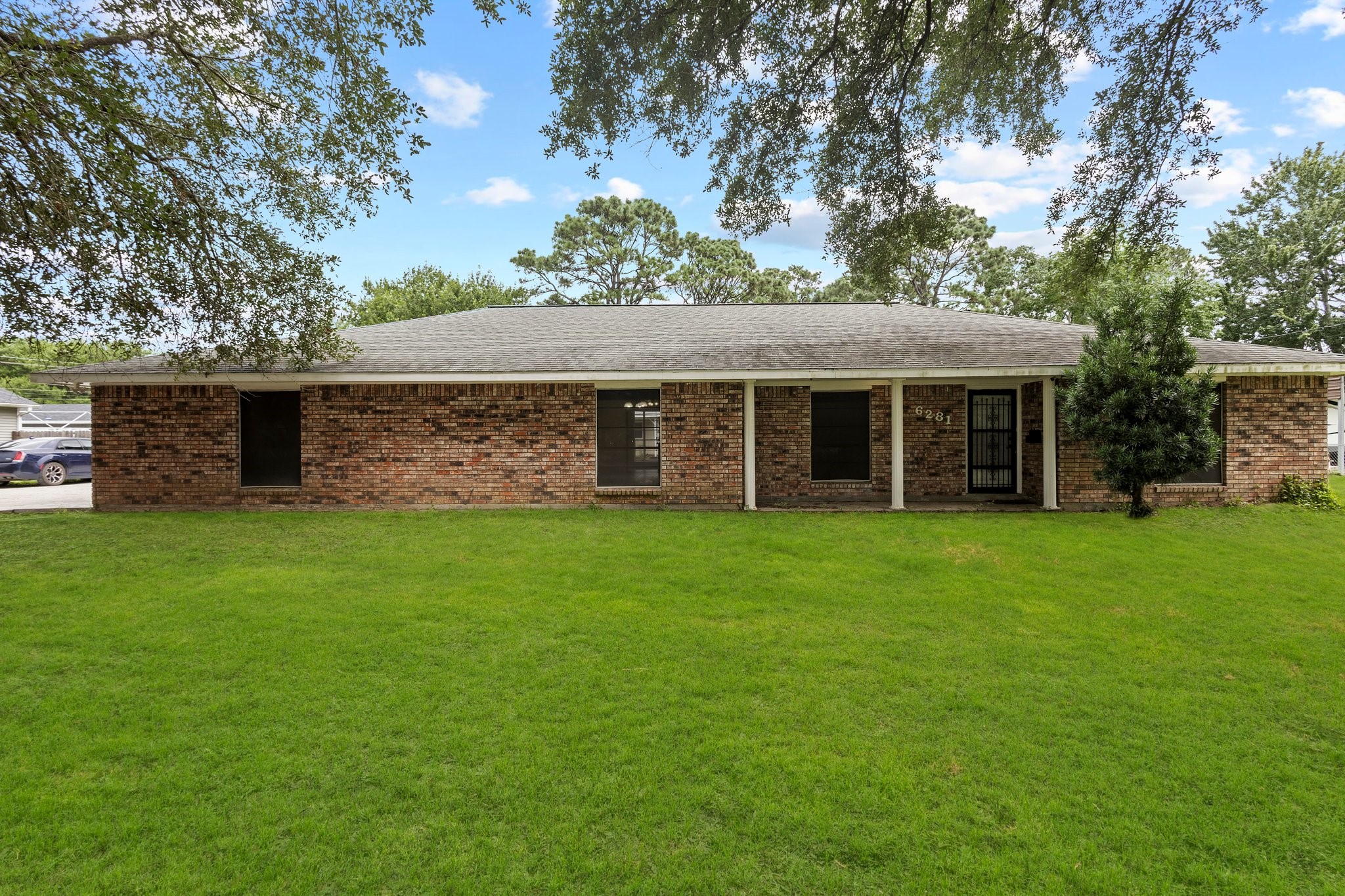 6281 25th Street Groves, TX 77619 - Photo 1 of 26 front view of a house with a yard