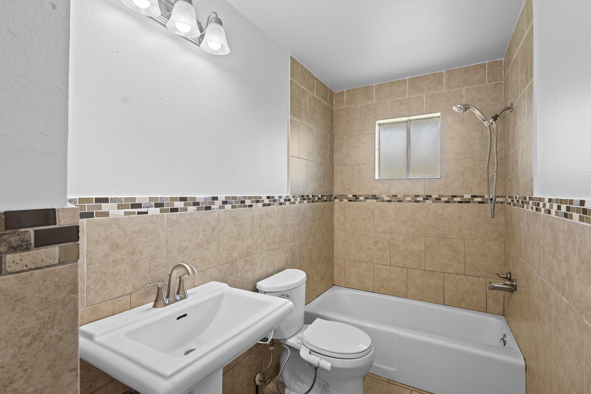 6281 25th Street Groves, TX 77619 - Photo 12 of 26 a bathroom with a sink toilet and shower