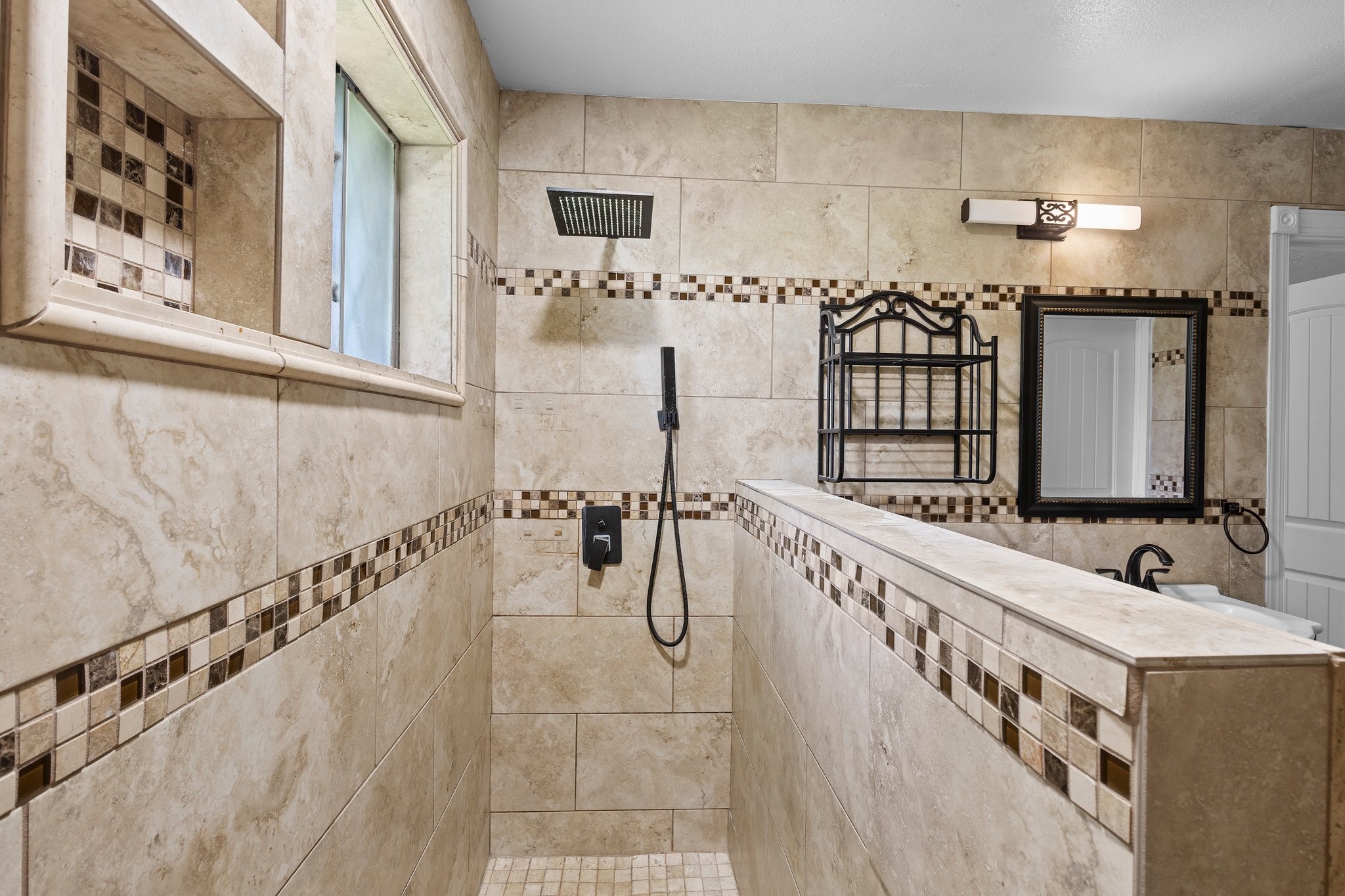 6281 25th Street Groves, TX 77619 - Photo 19 of 26 a bathroom with a bathtub and a double vanity sink