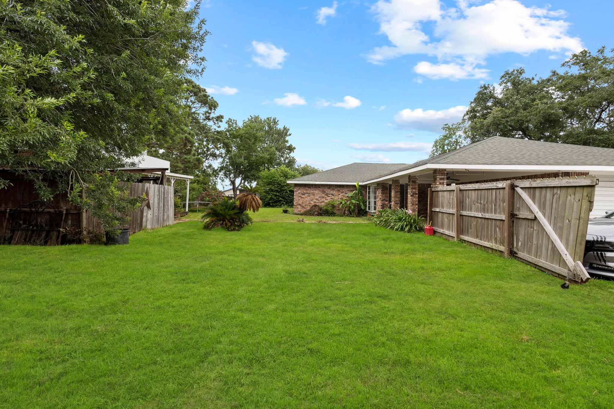 6281 25th Street Groves, TX 77619 - Photo 22 of 26 a view of a house with backyard and garden