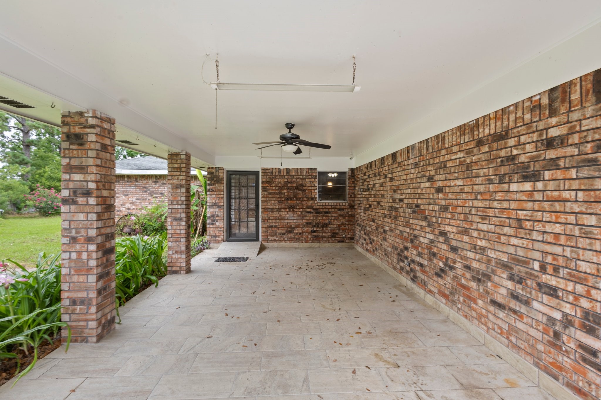6281 25th Street Groves, TX 77619 - Photo 25 of 26 a view of a pathway along a building