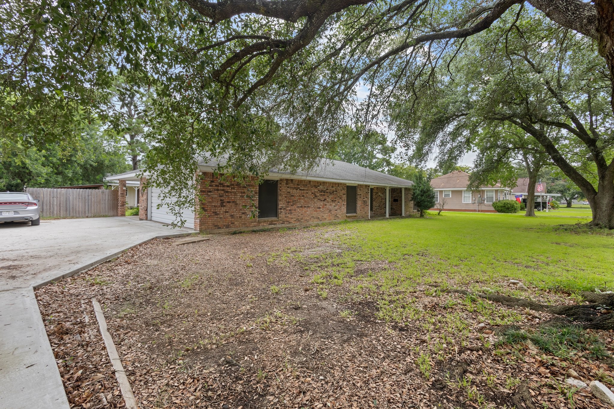 6281 25th Street Groves, TX 77619 - Photo 26 of 26 a backyard of a house with table and chairs