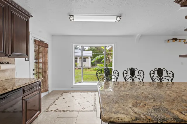 a view of a chandelier fan and wooden floor in a room