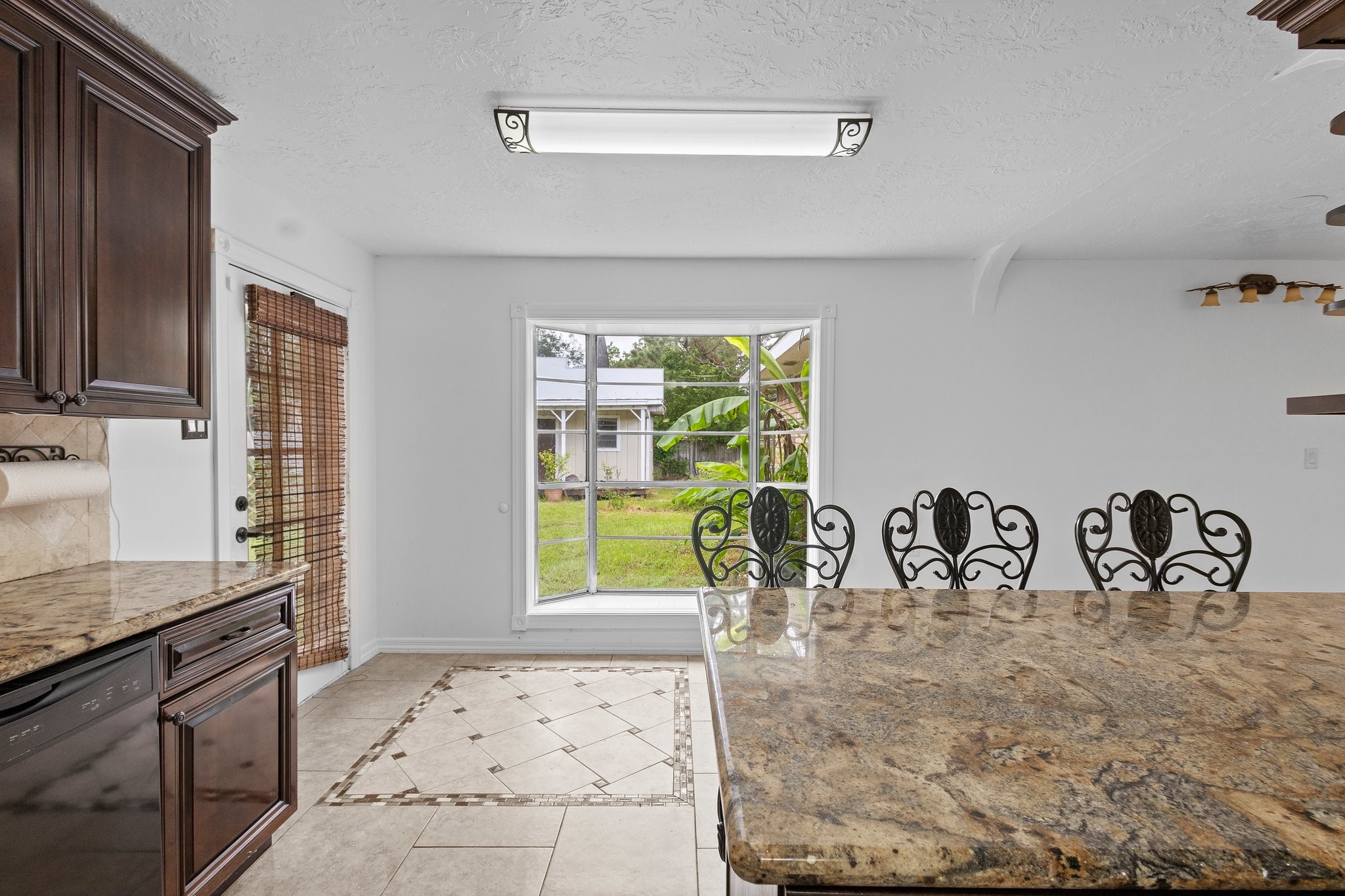 6281 25th Street Groves, TX 77619 - Photo 7 of 26 a view of kitchen with granite countertop window