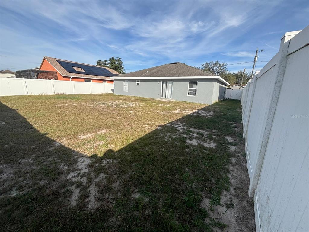 1757 Pompano Drive Kissimmee, FL 34759 - Photo 13 of 14 a view of a house with a yard