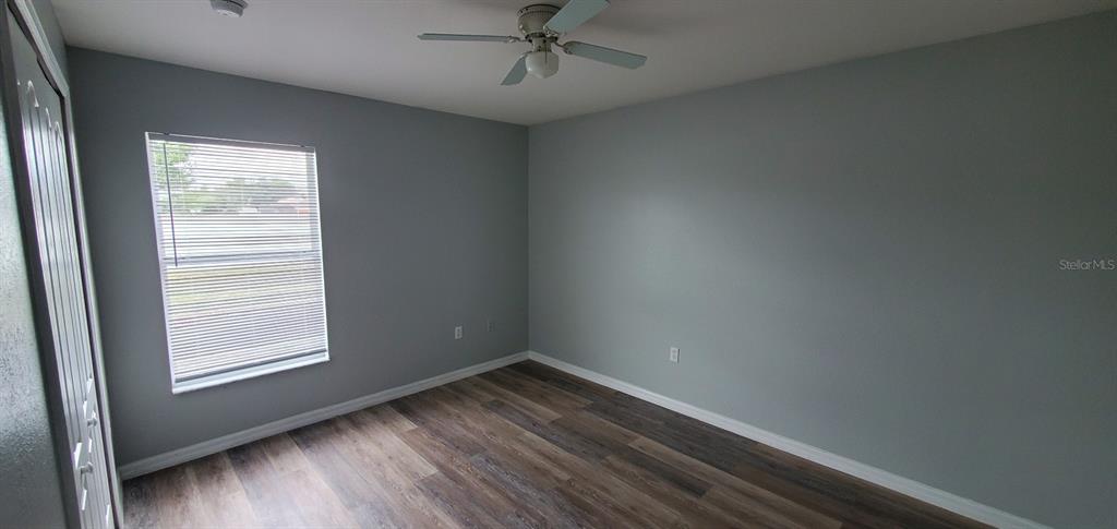 1757 Pompano Drive Kissimmee, FL 34759 - Photo 5 of 14 an empty room with a window