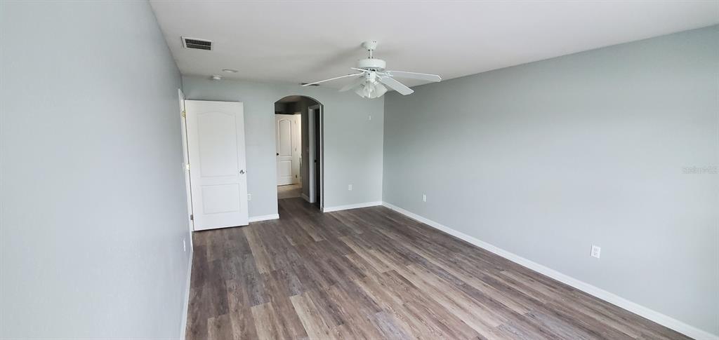 1757 Pompano Drive Kissimmee, FL 34759 - Photo 9 of 14 a view of a livingroom with wooden floor