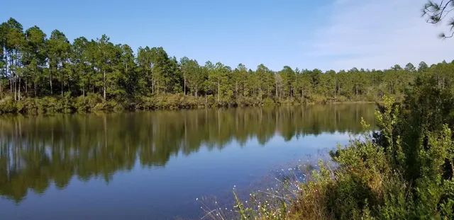 a lake view with mountain in the background