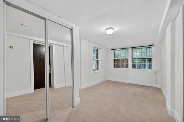 a view of an empty room with a window