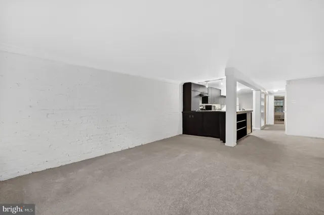 a big room with closet and windows