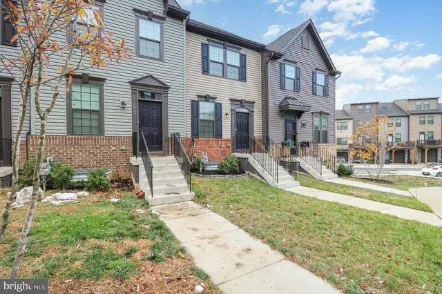 a front view of a house with garden and patio