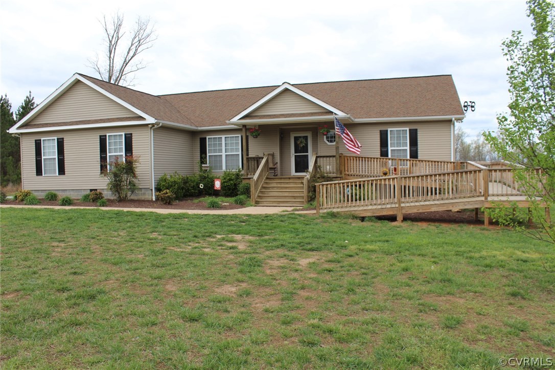 634 Holman Mill Road Farmville, VA 23901 - Photo 1 of 43 a front view of a house with garden