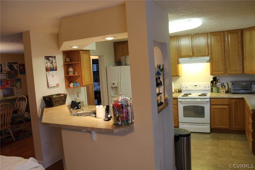 634 Holman Mill Road Farmville, VA 23901 - Photo 16 of 43 a kitchen with a sink cabinets and appliances