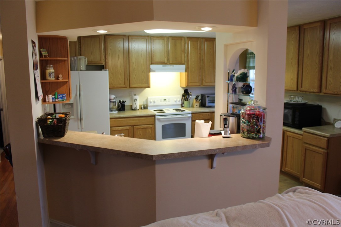 634 Holman Mill Road Farmville, VA 23901 - Photo 17 of 43 a kitchen with stainless steel appliances a sink stove and cabinets