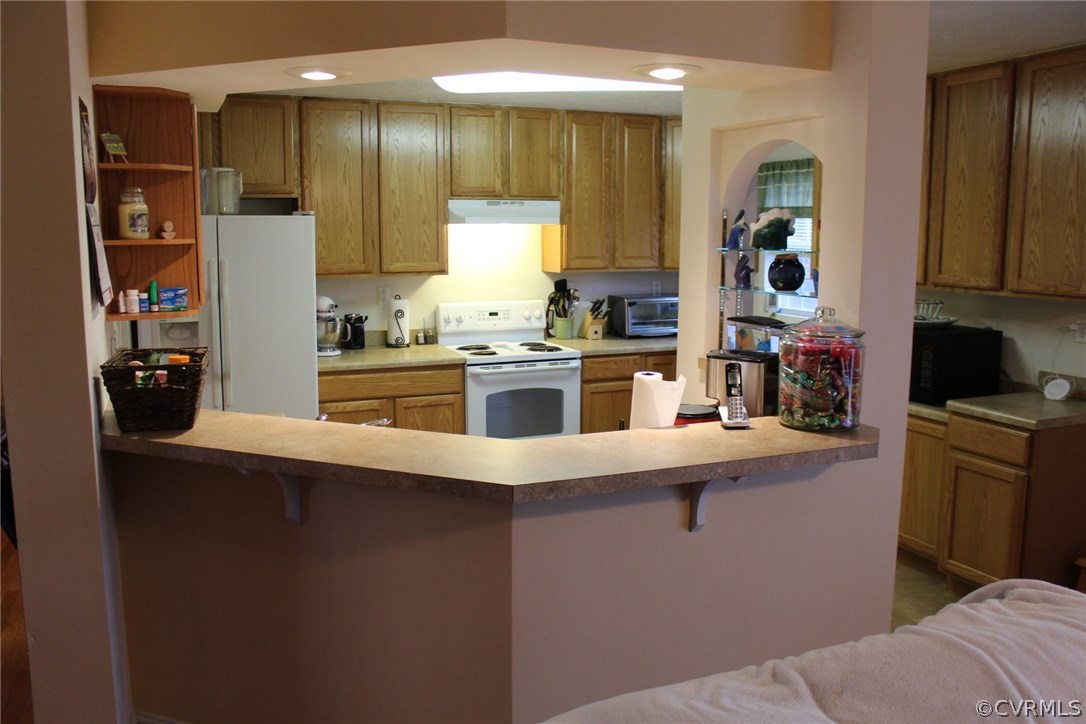 634 Holman Mill Road Farmville, VA 23901 - Photo 18 of 43 a kitchen with stainless steel appliances a sink stove and cabinets