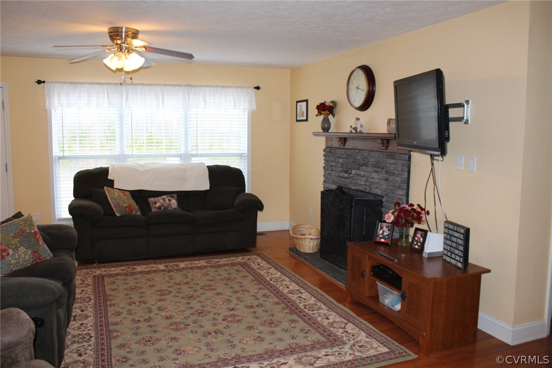 634 Holman Mill Road Farmville, VA 23901 - Photo 25 of 43 a living room with furniture and a fireplace