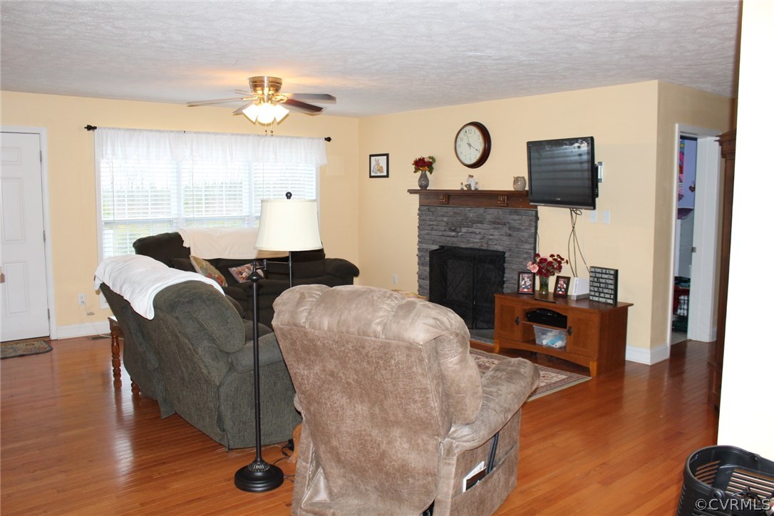 634 Holman Mill Road Farmville, VA 23901 - Photo 3 of 43 a living room with furniture and a fireplace