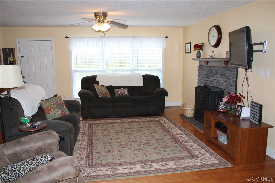 634 Holman Mill Road Farmville, VA 23901 - Photo 33 of 43 a living room with furniture and a fireplace
