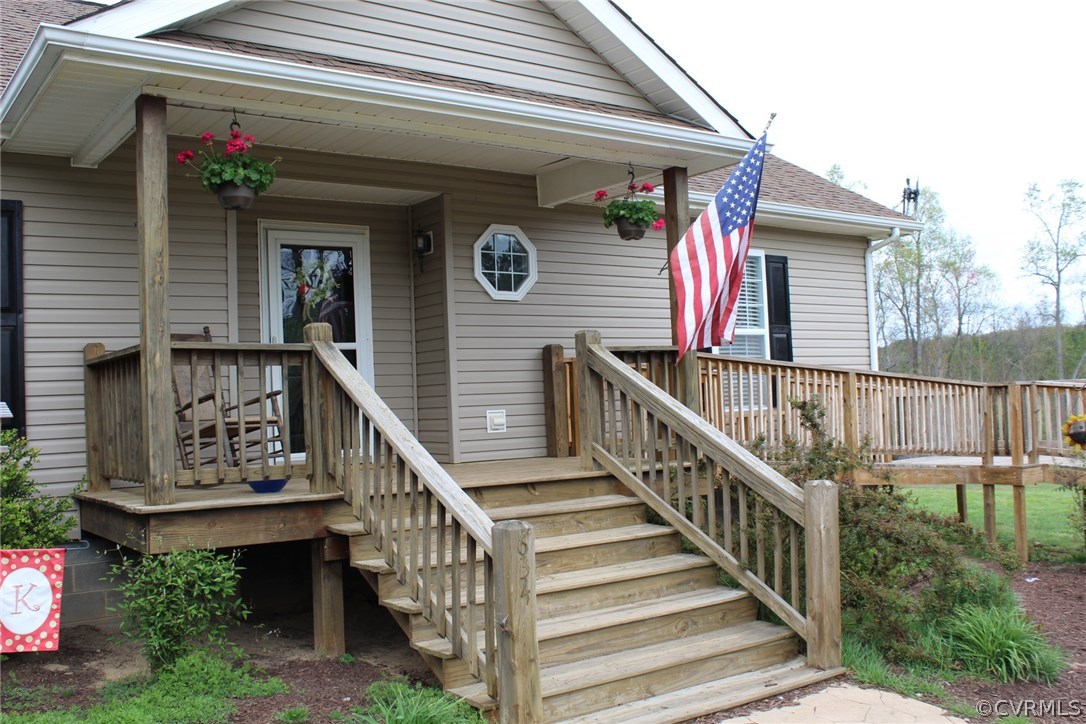 634 Holman Mill Road Farmville, VA 23901 - Photo 39 of 43 a view of a house with wooden stairs and a small yard
