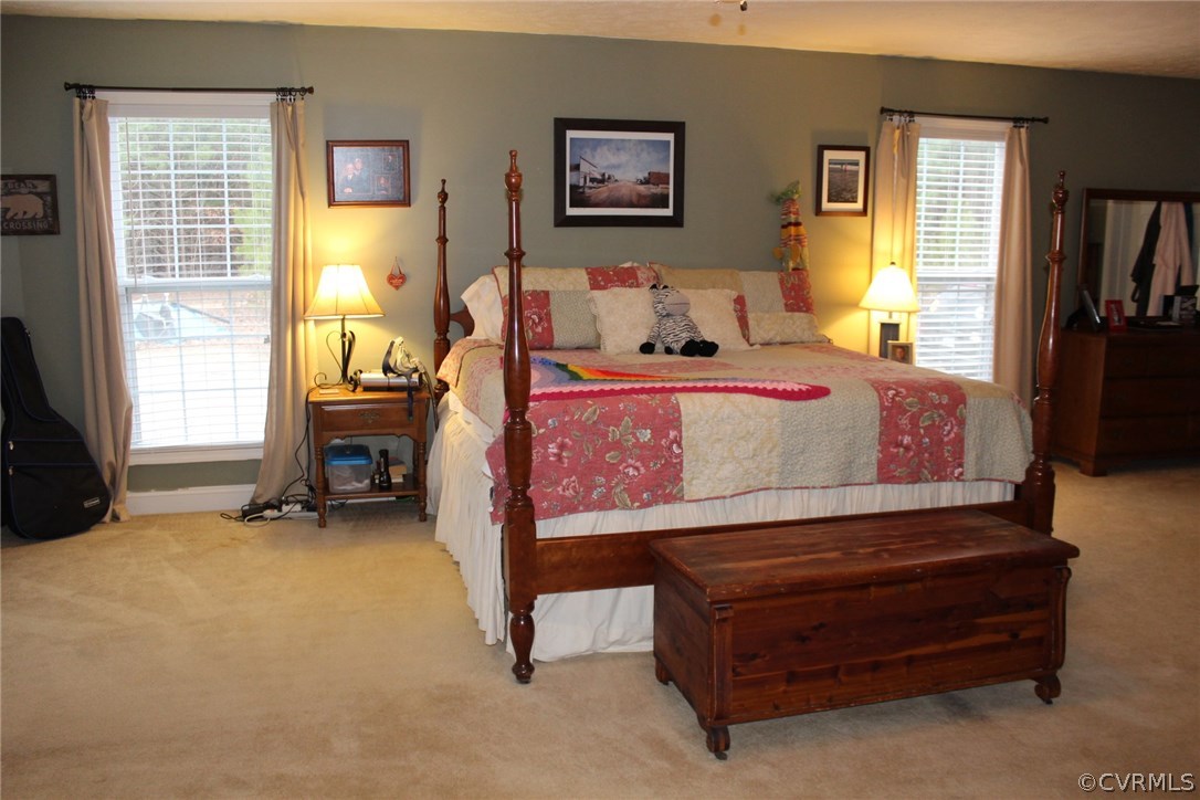 634 Holman Mill Road Farmville, VA 23901 - Photo 6 of 43 a bedroom with a bed and wooden floor