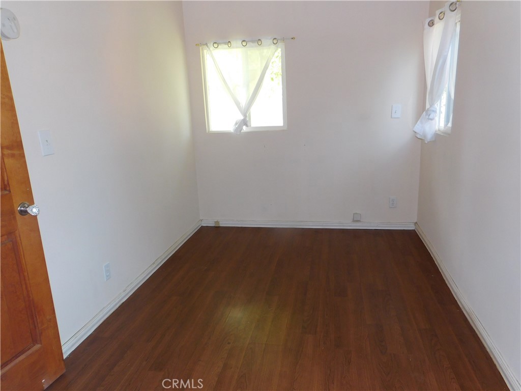 15868 Main Street Middletown, CA 95461 - Photo 13 of 16 an empty room with a window