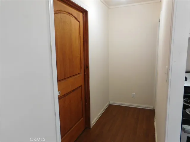 a view of a small space with wooden floor