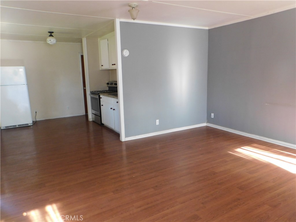 15868 Main Street Middletown, CA 95461 - Photo 16 of 16 a view of empty room with wooden floor and window