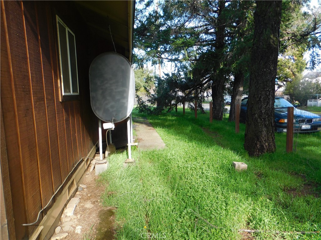 15868 Main Street Middletown, CA 95461 - Photo 3 of 16 a backyard of a house with table and chairs