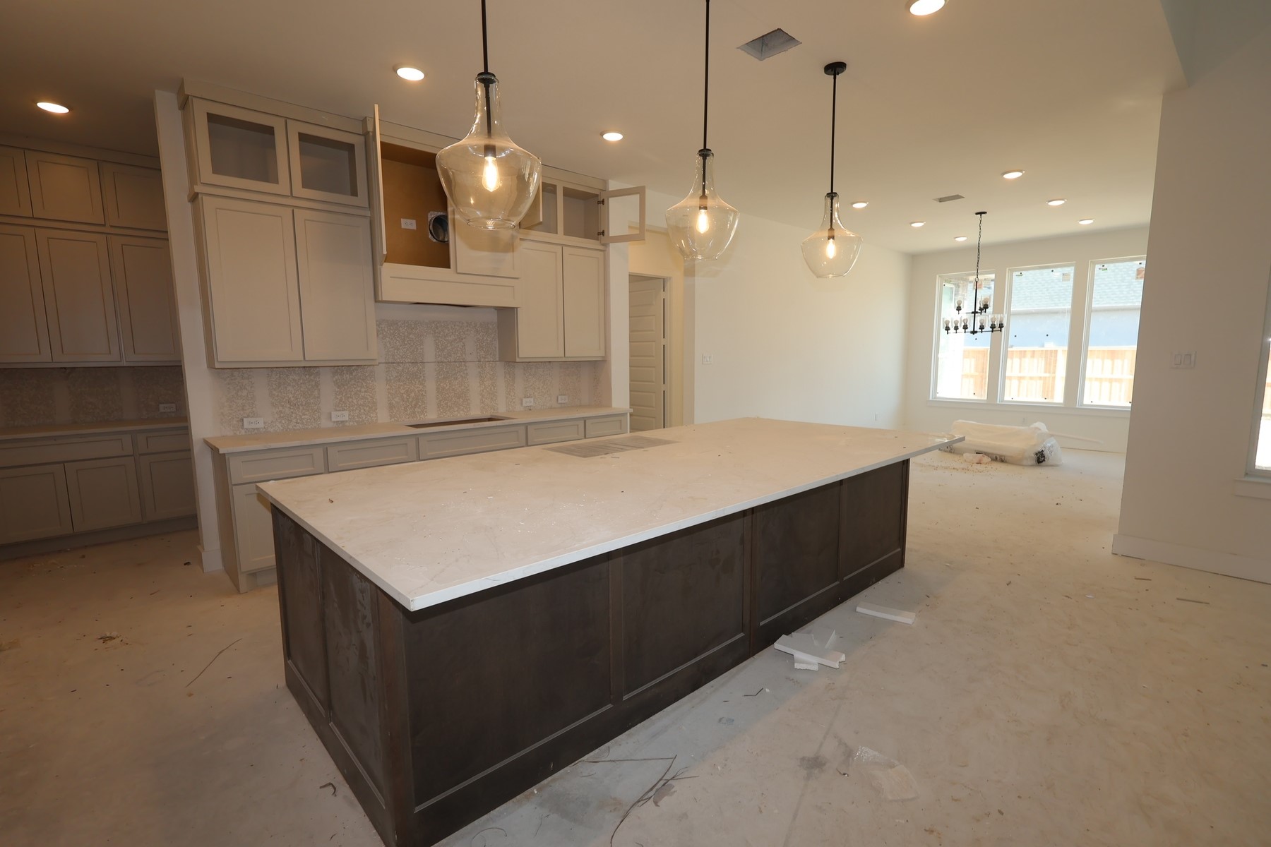 28117 Fox Bnd Drive Spring, TX 77386 - Photo 3 of 6 a large kitchen with kitchen island a sink stainless steel appliances and a chandelier