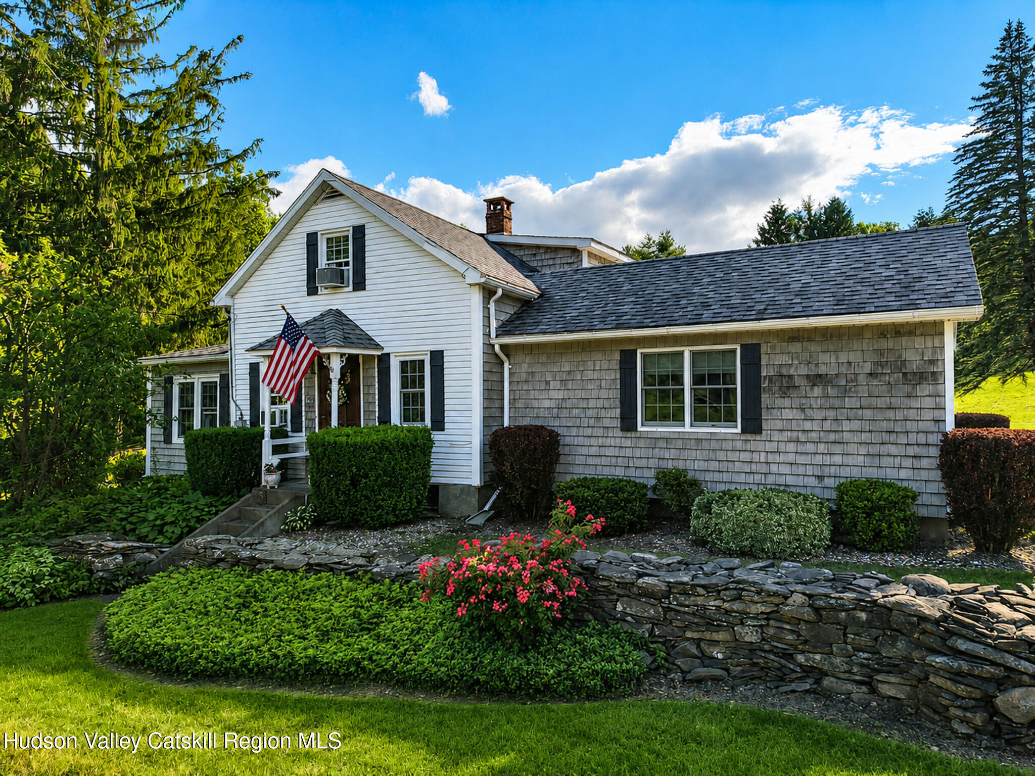221 Camp Medusa Road Rensselaerville, NY 12120 - Photo 2 of 57 a front view of a house with a garden
