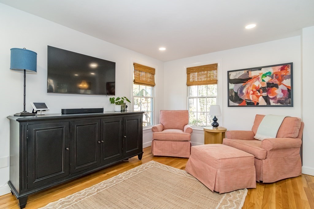 54 Northgate Road Wellesley, MA 02481 - Photo 6 of 19 a living room with furniture and a flat screen tv