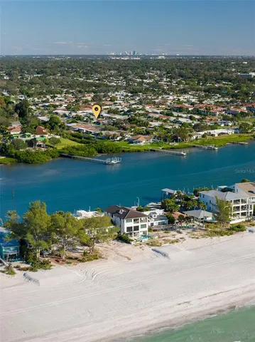 a view of a dining room with furniture and a potted plant