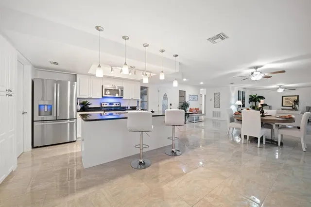 an aerial view of a house with a yard and garden