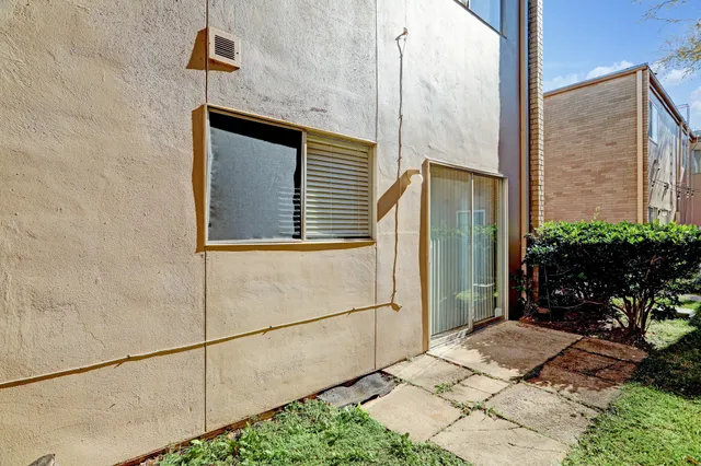 a backyard of a house with seating space