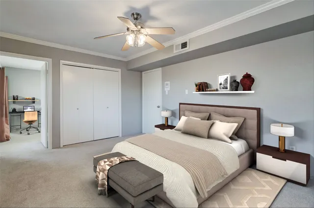 a bedroom with a bed and a chandelier