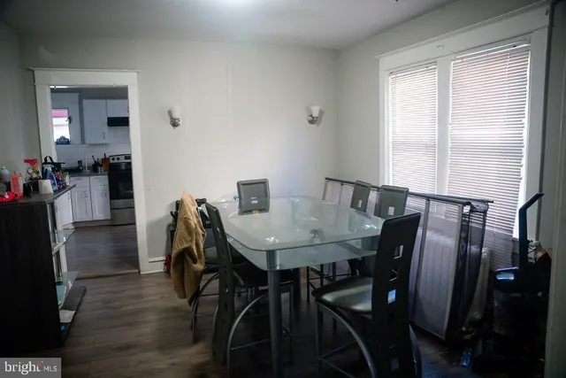 a view of a dining room with furniture and a window