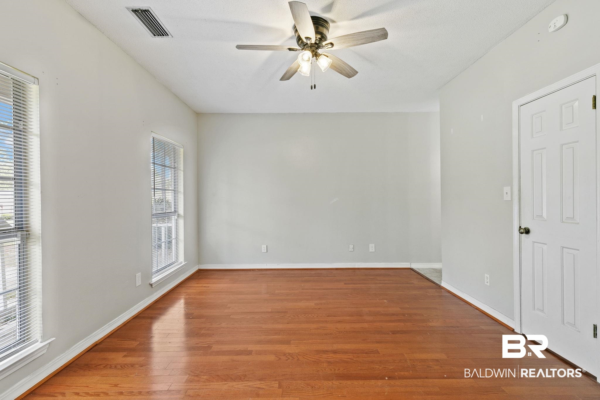 474 Ridgewood Drive Daphne, AL 36526 - Photo 27 of 57 Unfurnished room with wood-type flooring and ceiling fan